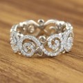 Brilliantly Carved Infinity Wedding Band with Pave Diamonds