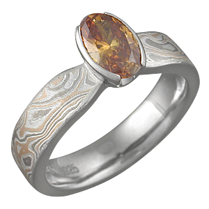 Mokume Solitaire Tapered Engagement Ring with Orange Sapphire
