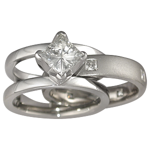 Modern Scaffolding Engagement Ring with Princess Cut Diamond and Plain Band with Princess Diamonds