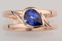 swirl pear shaped  blue sapphire engagement ring