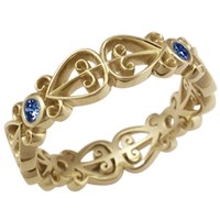 african love symbol wedding band in yellow gold with sapphires