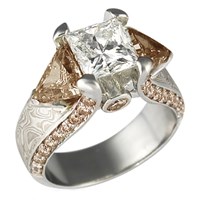juicy light three stone engagement ring with champagne diamonds