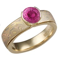 trigold mokume solitaire straight engagement ring with pink sapphire