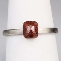 rose cut raw diamond on white metal