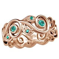 vine and leaf wedding band in rose gold with emerald accents