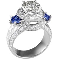 juicy goddess engagement ring with white diamonds and blue sapphire side stones