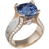 14k rose gold mokume juicy light engagement ring with sapphire