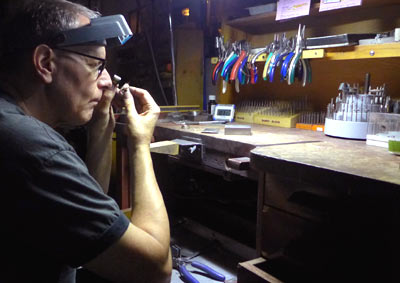 Jeweler working on mokume ring Jeweler working on mokume ring