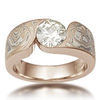 mokume solitaire engagement ring with round diamond