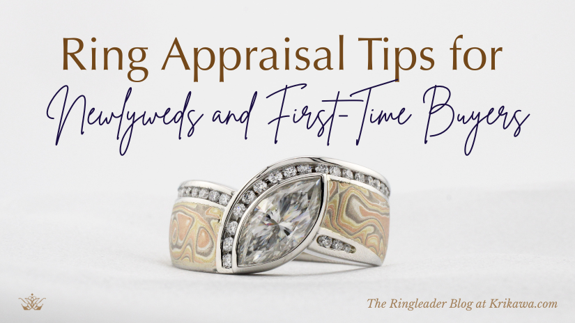 An engagement ring with a large marquise shaped diamond sits on white silk.