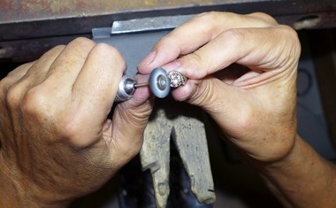 master jeweler burnishing a ring