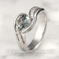 Carved Wave Engagement Ring with a Brilliant Light Green Sapphire