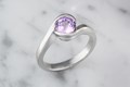 Carved Wave Light Engagement Ring in Platinum with a Purple Sapphire