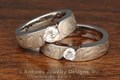 Mokume Wave Engagement Ring with a contoured band, flush set stone, and organic styling