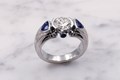 Similar to its predecessor, the Carved Curls Engagement Ring, this luxury ring's band is inlaid with mokume gane. 