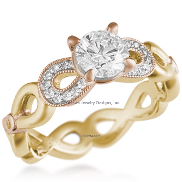 This engagement ring features infinity symbols around the band.  The infinity beneath the head has diamond pave and millegrain detail. 
