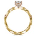This engagement ring features infinity symbols around the band.  The infinity beneath the head has diamond pave and millegrain detail. 