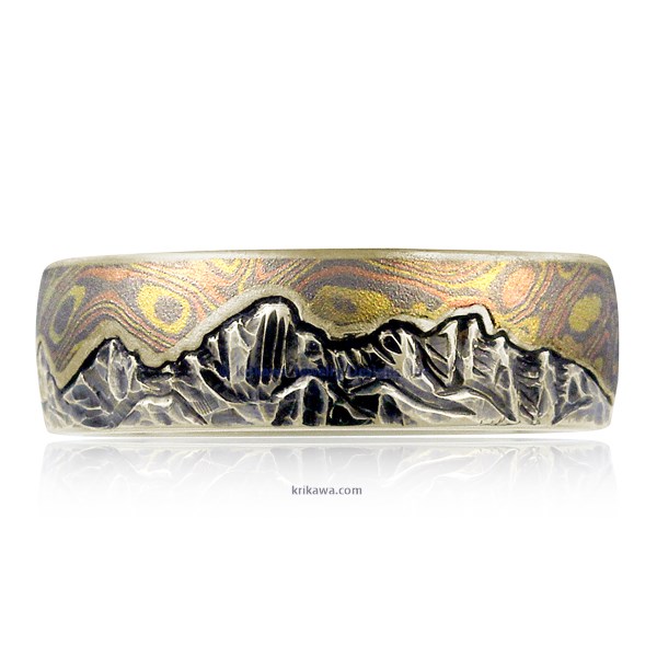 This artisan wedding band has an engraved mountain range, and a sky inlaid with mokume. For a truly one-of-a-kind ring, choose your favorite mokume flavor, and send us a picture of the mountains that have meaning for you!