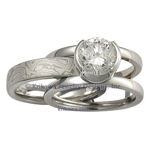 Modern Scaffolding Engagement Ring with Round Diamond and Two Cutout Head with White Mokume Band