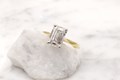 Shown here with a beautiful emerald cut diamond, this perfect solitaire design will showcase any diamond or gemstone to perfection. 