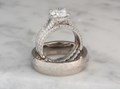 This gorgeous engagement ring has a pave band with a rope twist at the bottom. This ring has a juicy profile that is tapered and splits into high-arched prongs.