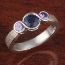 Three Stone Infinity Mokume Engagement Ring with Sapphire