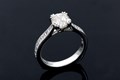 With a nod to the vintage era, the millegraining and sculpted prongs on this delightful engagement ring provide the intricate detail. 