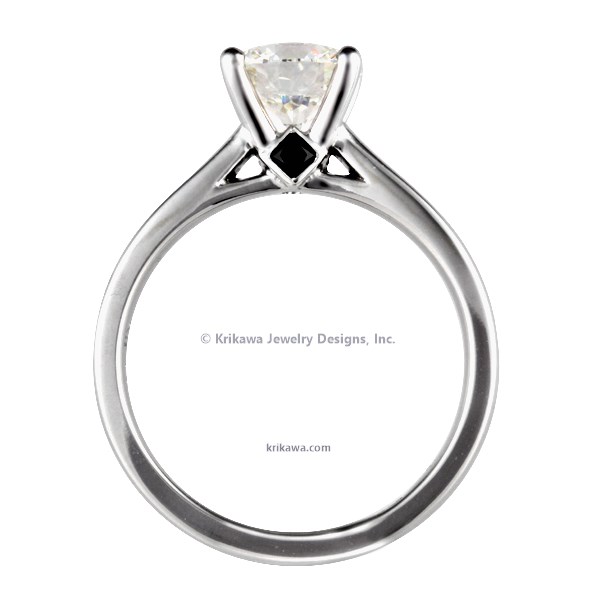 A sleek, modern band gracefully flows into a gorgeous cathedral-set solitaire gem in this lovely ring.