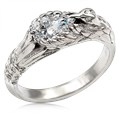  This hummingbird engagement ring is a miniature sculpture in every sense!  The band features a delicate hummingbird's wings cradling the solitaire center stone. Accent stones decorate the bird's head and tail for extra sparkle. 