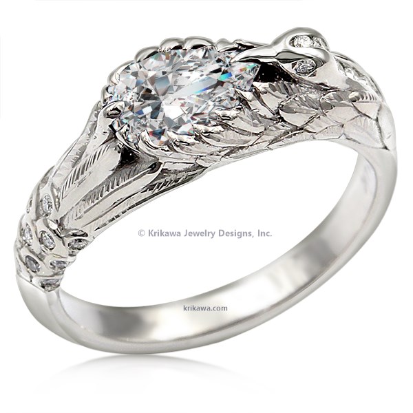  This hummingbird engagement ring is a miniature sculpture in every sense!  The band features a delicate hummingbird's wings cradling the solitaire center stone. Accent stones decorate the bird's head and tail for extra sparkle. 