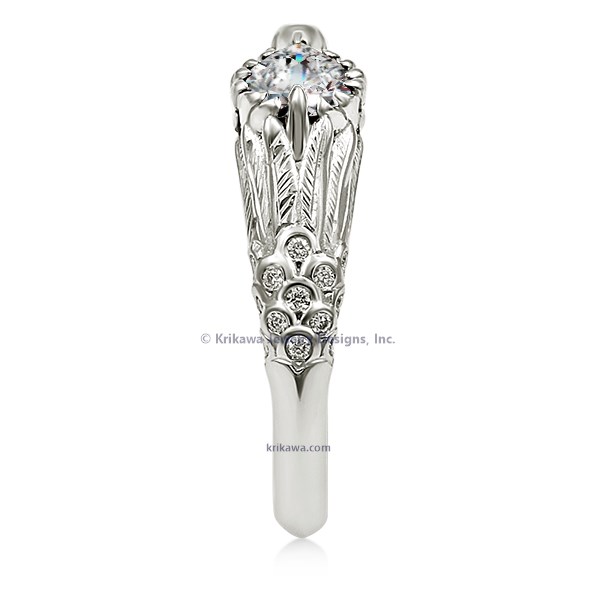  This hummingbird engagement ring is a miniature sculpture in every sense!  The band features a delicate hummingbird's wings cradling the solitaire center stone. Accent stones decorate the bird's head and tail for extra sparkle. 