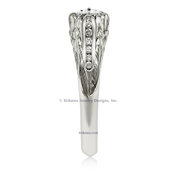  This hummingbird engagement ring is a miniature sculpture in every sense!  The band features a delicate hummingbird's wings cradling the solitaire center stone. Accent stones decorate the bird's head and tail for extra sparkle. 