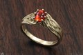 Embracing Tree Branch Engagement Ring in 10k Green Gold with Oval Orange Sapphire