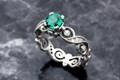 
Infinity Leaf Diamond Engagement Ring with a Round Lab Created Emerald Center Stone.