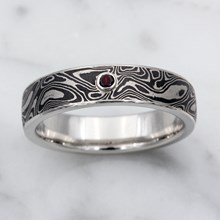 Black And White Mokume Wedding Band With Garnet Accent - top view