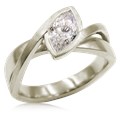 A simplified, modern version of our classic River Twist Engagement Ring this engagement ring features a solitaire stone set at an angle and suspended above a band that flows beneath like a river.