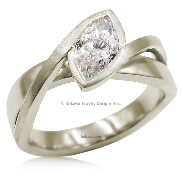 A simplified, modern version of our classic River Twist Engagement Ring this engagement ring features a solitaire stone set at an angle and suspended above a band that flows beneath like a river.