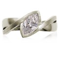 A simplified, modern version of our classic River Twist Engagement Ring this engagement ring features a solitaire stone set at an angle and suspended above a band that flows beneath like a river.