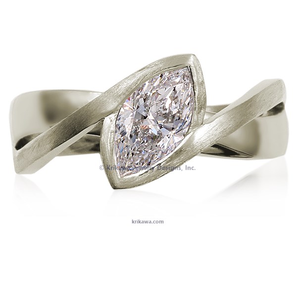 A simplified, modern version of our classic River Twist Engagement Ring this engagement ring features a solitaire stone set at an angle and suspended above a band that flows beneath like a river.