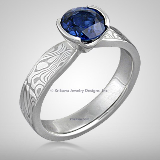 White Mokume Solitaire Tapered Engagement Ring With Round Blue Sapphire