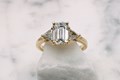 Emerald And Triangle Three-Stone Engagement Ring
