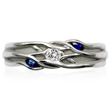 Embracing Brach Three-Stone Accent Wedding Band - top view