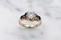 A ring that celebrates your playful nature! A band made of intertwining branches holds a variety of stones.