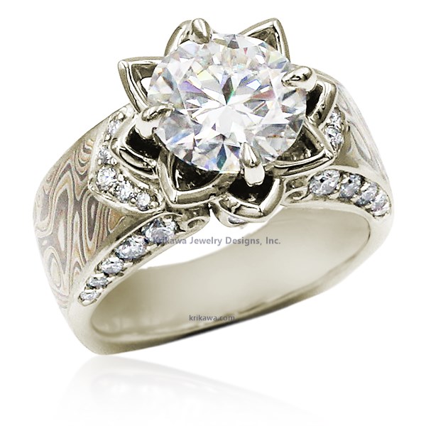 Embrace a love story embodied by the graceful lotus blossom, a symbol of purity and unwavering devotion. Our wider mokume gane ring design, adorned with accent diamonds, highlights the sculptural beauty of the lotus. 