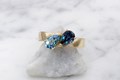 Modern Two-Stone River Twist Engagement Ring