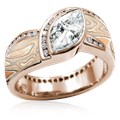 Mokume Wave Diamond Crossing Engagement Ring with blue diamond