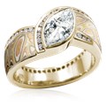 Mokume Wave Diamond Crossing Engagement Ring with blue diamond