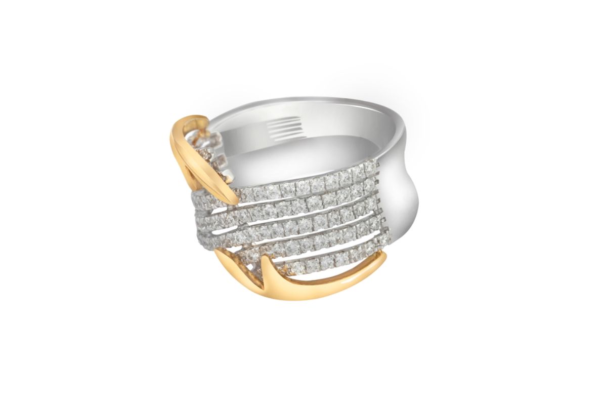A mixed metal ring with diamond rows wraps a white gold band and curves into yellow gold accents along the sides.