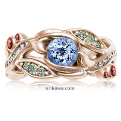 Garden Trellis Engagement Ring in 14k rose gold with Cornflower Blue sapphire centerstone. Green diamonds, white diamonds and Pad sapphire accents