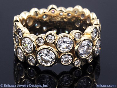 yellow gold and diamond ring in bezels